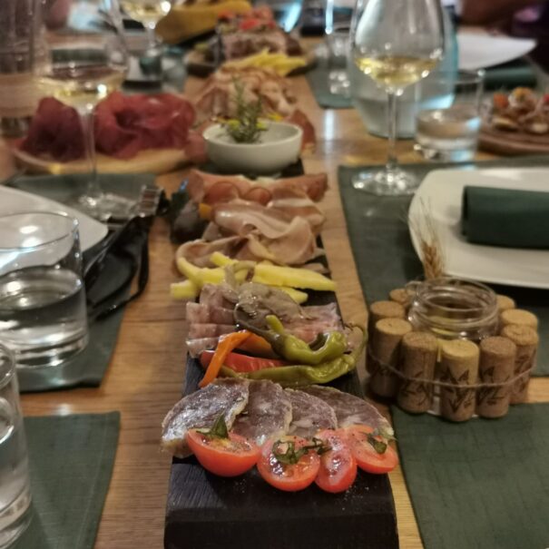 Local cold cuts and wine on the table
